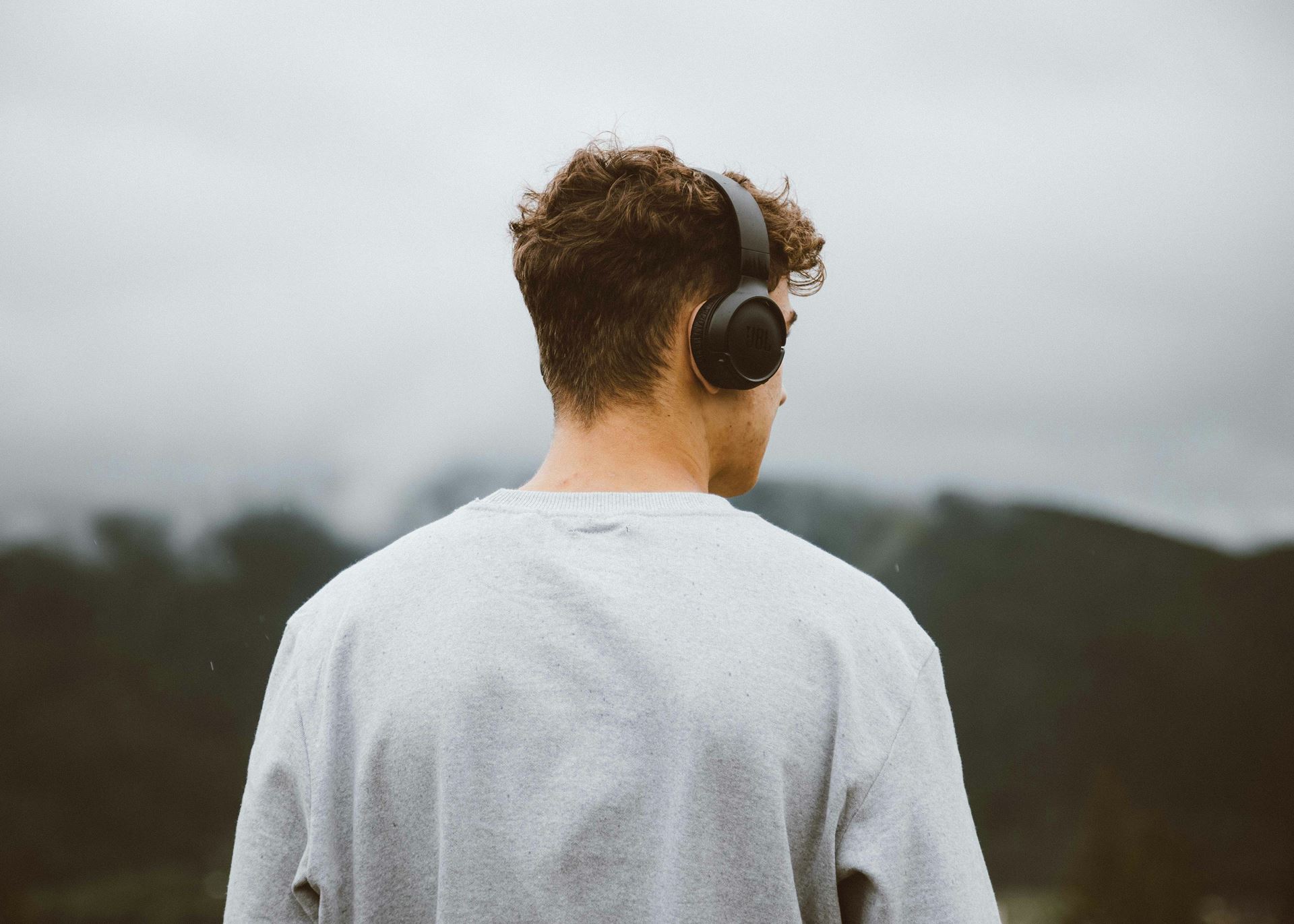 man listening to headphones